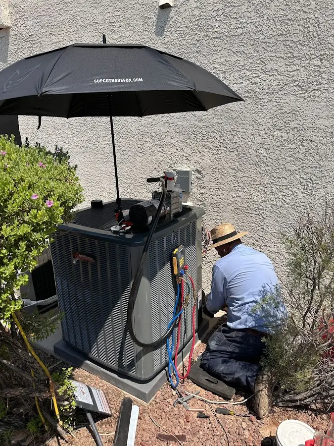 HVAC technician performing outdoor AC maintenance in Boyes Hot Springs
